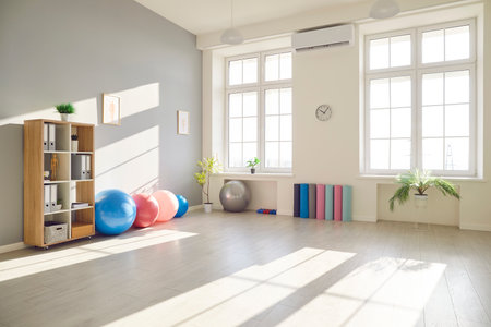 Room with gym equipment, medical, fitness class for exercise and space for playing indoor sport. Sporty med office interior, exercising body, increasing strength, assembly or meeting, club gatheringの写真素材
