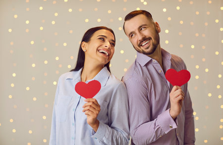 Valentine day loving couple with red paper heart, people happy in love, man, woman enjoy romantic...