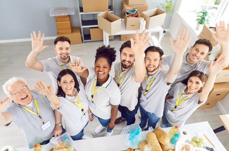 Portrait of a multinational team of happy volunteers working at a humanitarian aid organization or donation center. They embody teamwork and dedication to charity and community service.の写真素材