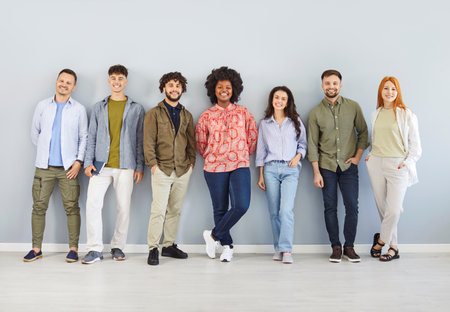 Portrait of a diverse group of happy individuals, including students, coworkers, or friends. Smiles...