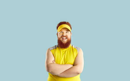 Portrait of a happy, bearded man exclaims wow as he looks up in amazement on a blue background. Amazement and surprise, capturing a joyful and unexpected moment full of positive emotions.の写真素材