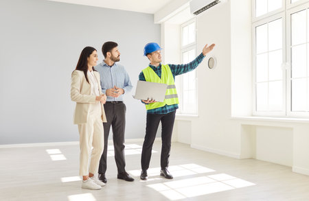 Professional foreman worker and family clients supervise and direct, meeting looking at project...