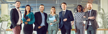 Group portrait of happy smiling diverse colleague, businesspeople looking at camera, team of trainee interns and coaches posing together in office, different ages teamwork, project planning joyの写真素材