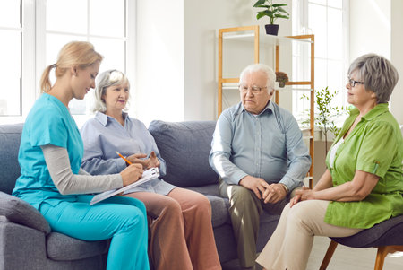 Doctor or nurse performing a medical checkup for a group of senior patients in a nursing home. Focus is on healthcare, regular medical assessments, and the dedicated care provided to elderly patients.の写真素材