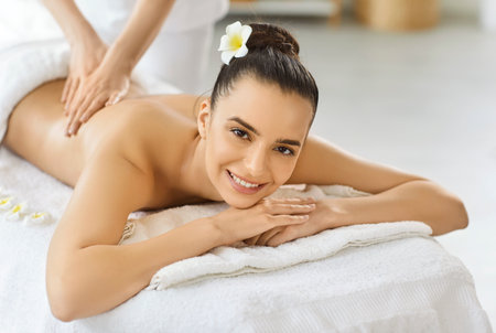 Professional Thai massage treatment with aromatherapy, massage therapist doing aromatherapy, oils massage, woman enjoying relaxing aromas spa, asian flower natural aromatics pleasure, soothing bodyの写真素材