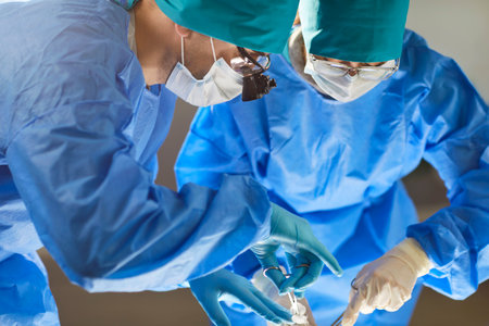 Surgeon group of professional medical doctors at work, surgical team performing surgery operation,...