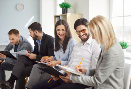 Smiling diverse office workers group, happy hr team of employees, motivated successful business people, staff together in modern room, colleagues talk, motivated successful business people gatherの写真素材