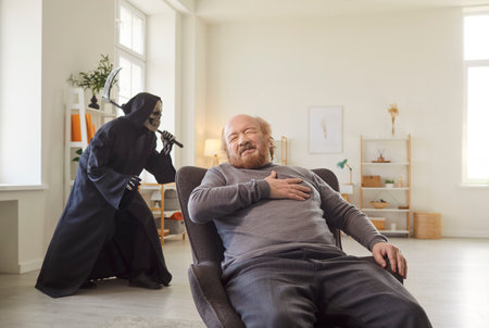Senior man sitting at armchair, clutching chest in pain while grim reaper with scythe sneaking behind. Alone male pensioner experiencing heart attack or infarct at home, feeling closeness of death.の写真素材