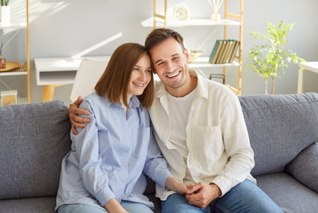 Home care loving smiling family in healthy relationship, sitting close married couple after buying house, happy mortgage agreement, apartment renters, apartment owners, relocation tenant serviceの写真素材