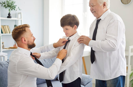 Family of three generation men tying tie, senior grandfather, father, son, child grandson at home...