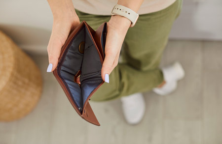 No money empty wallet close up, hands opening holding purse without cash after bankruptcy paying...