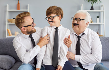 Happy funny three generation men, grandfather, father, son at home have fun play, cute excited dad...