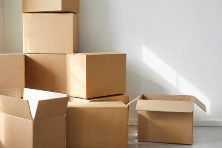 Stack of cupboards, heap of open boxes, multiple storage packing cabinets for delivery placed one on...