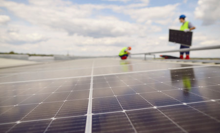 Close up view of a solar panels installed on a roof. The photovoltaic panels capture renewable...