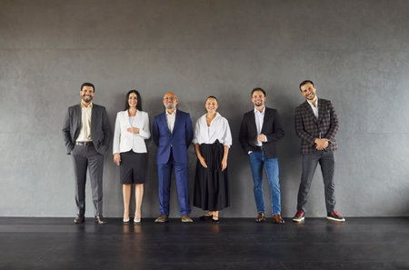 Full length shot of six busness people dressed formally, ready for corporate meeting, isolated over...
