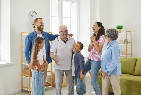 Big friendly family talking each other at home. Photo of happy family of grandparents, mom, dad and...