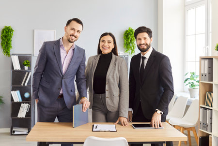 Group portrait of happy business partners team in modern office, successful employees standing...