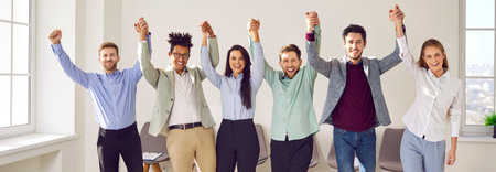 Team of happy young diverse business people having fun in office. Group of cheerful, joyful men and...