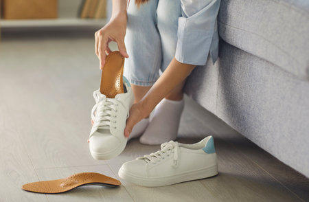 Orthopedic insoles help prevent foot issues, support posture and improve walking comfort. They represent medical care, stability daily wellness for long term prevention. Healthy feet support daily.の写真素材