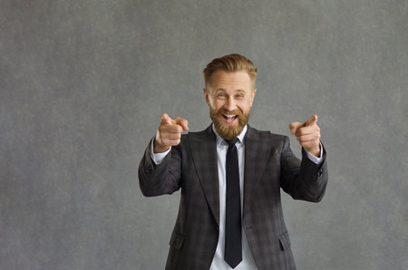 Happy positive cheerful entrepreneur, business recruiter, corporate head hunter on grey background...
