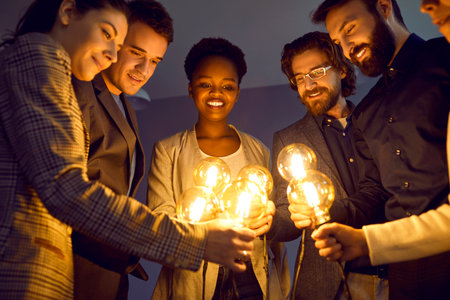 Multiracial business team sharing ideas, inspiration and creative energy with each other. Diverse...