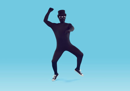 Full length shot of a funny man disguised in a black skin tight spandex bodysuit costume,...