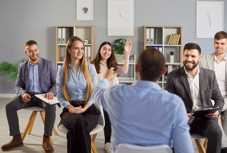 Businessman answering on questions from business team during office meeting, scene of a work and...