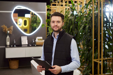 Sales manager, selling, distributing and marketing, ready helping clients to choose, type of plumber repairs work of future flat, interior designer, materials for renovation, market employee portraitの写真素材