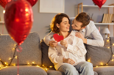 Happy Valentines Day hearts shape greeting card giving, loving couple, family at home feel...