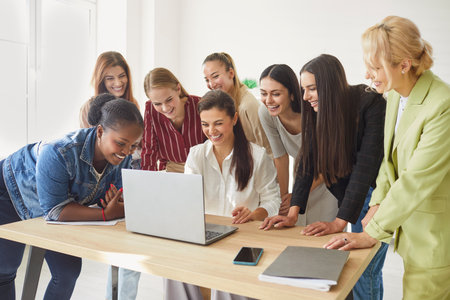 Female group happy coaching training at laptop online counseling or instructing diverse friends,...