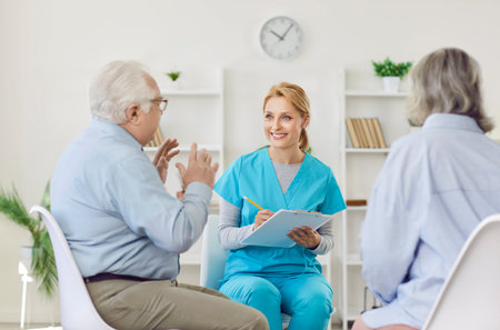Senior people care, communication, young kind nurse, geriatric medicine caretaker talking to old woman, man, nursing home residents, adults in assisted living, female doctor caregiving service, aidの写真素材