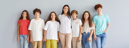 Teacher, group of young happy students, teens, friends close together, youth unity team club, positive communication skill, developing friendly community of people, smiling, laughingの写真素材