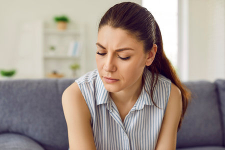 Closeup close up portrait sad depressed unhappy distraught insecure vulnerable exhausted woman thinking about life crisis trying to overcome difficulties, guilt, regret, breakup, painの写真素材