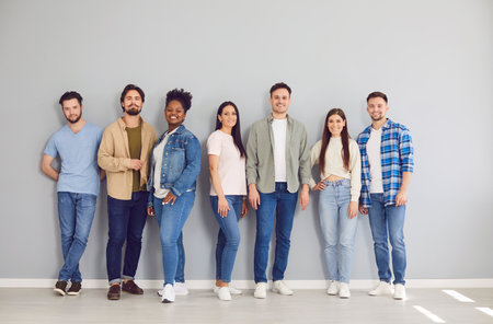 Portrait of a group of diverse young confident smiling friends students or colleagues in casual...