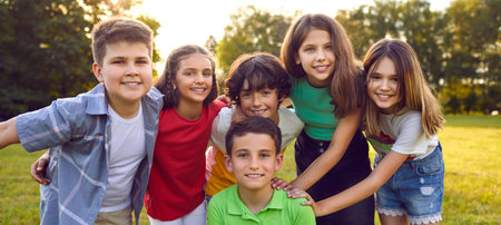 Panoramic portrait boys and girls smiling looking at camera at children birthday event or kids...
