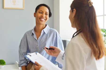 Medicine and health care concept. Experienced woman doctor giving consultation during medical...