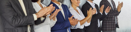 Close-up of diverse business team hands applauding in a corporate meeting, showing unity, colleagues...