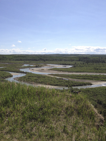 serpentine river seen from the slopeの写真素材