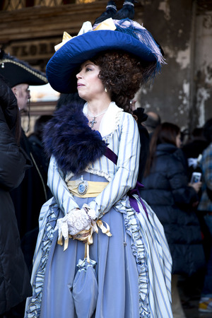 VENICE, ITALY, February 23, 2014: Carnival of Venice, beautiful masks at St. Mark's Squareのeditorial素材
