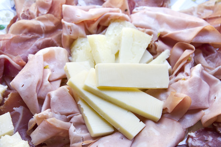 Plate with cheese, salami, prosciutto and mortadellaの写真素材