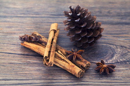 Stars anise and cinnamon isolated on a wooden background