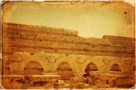 Libya Tripoli Leptis Magna Roman archaeological site - stone arches with carved figures of medusa or gorgon headsの写真素材
