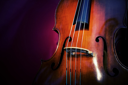 Close-up of double bass, wooden musical instrument that is played with a bowの写真素材