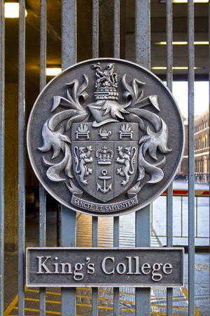Honorific emblem on the entrance gate of King's College in London, public view from streetのeditorial素材
