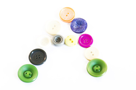 Buttons of different colors and types on a white backgroundの写真素材