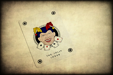 The Jolly Joker. Playing card on a white backgroundのeditorial素材