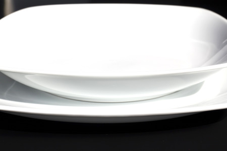  White plate on a black background