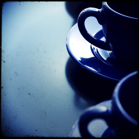 Blue empty coffee cups on wooden backgroundの写真素材