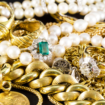 Closeup of gold jewelery with precious stonesの写真素材