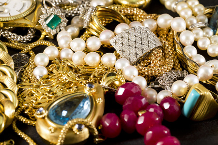 Closeup of gold jewelery with precious stonesの写真素材